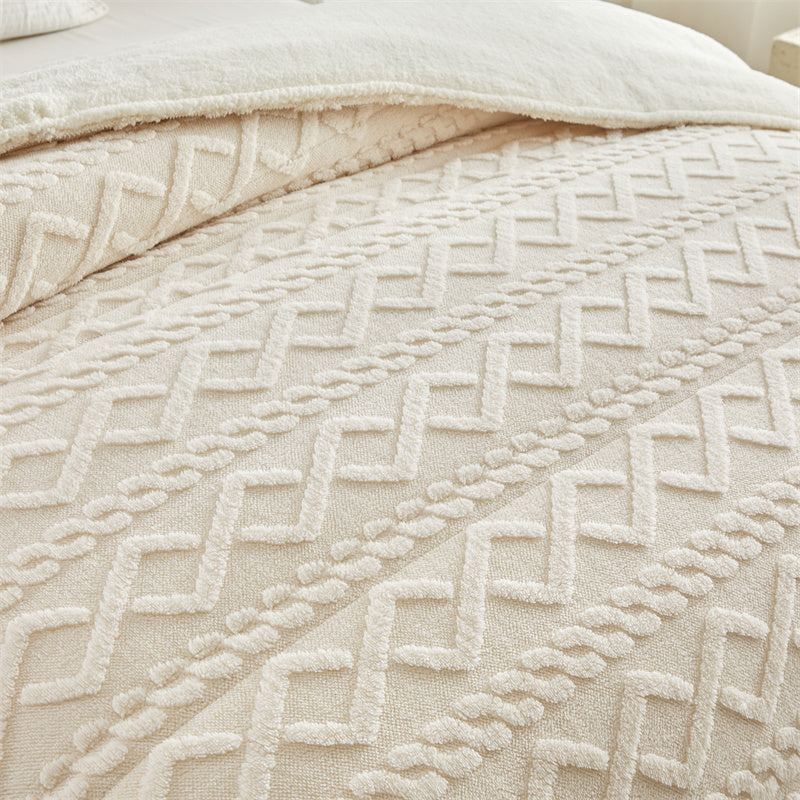 Luxuriously soft and thick warm blanket draped over a cozy bed - ultimate comfort meets style.